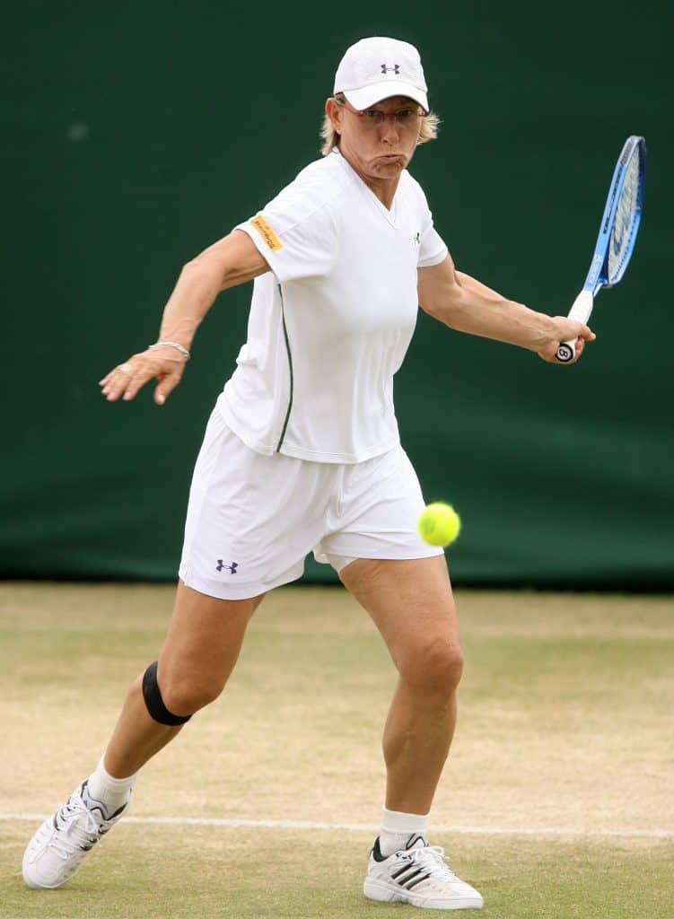 Navratilova of US plays a shot to China's Yan Zi and Zheng Jie during women's quarter-final doubles match in London