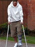 Photo of David Beckham wearing a reusable plastic cast walker