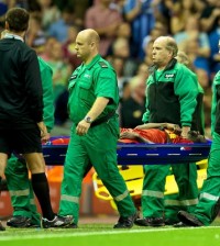 Kolo Toure leaves the field on a stretcher.