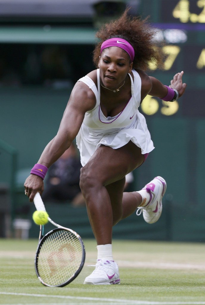 Serena Williams of the U.S. hits a return to Agnieszka Radwanska of Poland during their women's final tennis match at the Wimbledon tennis championships in London