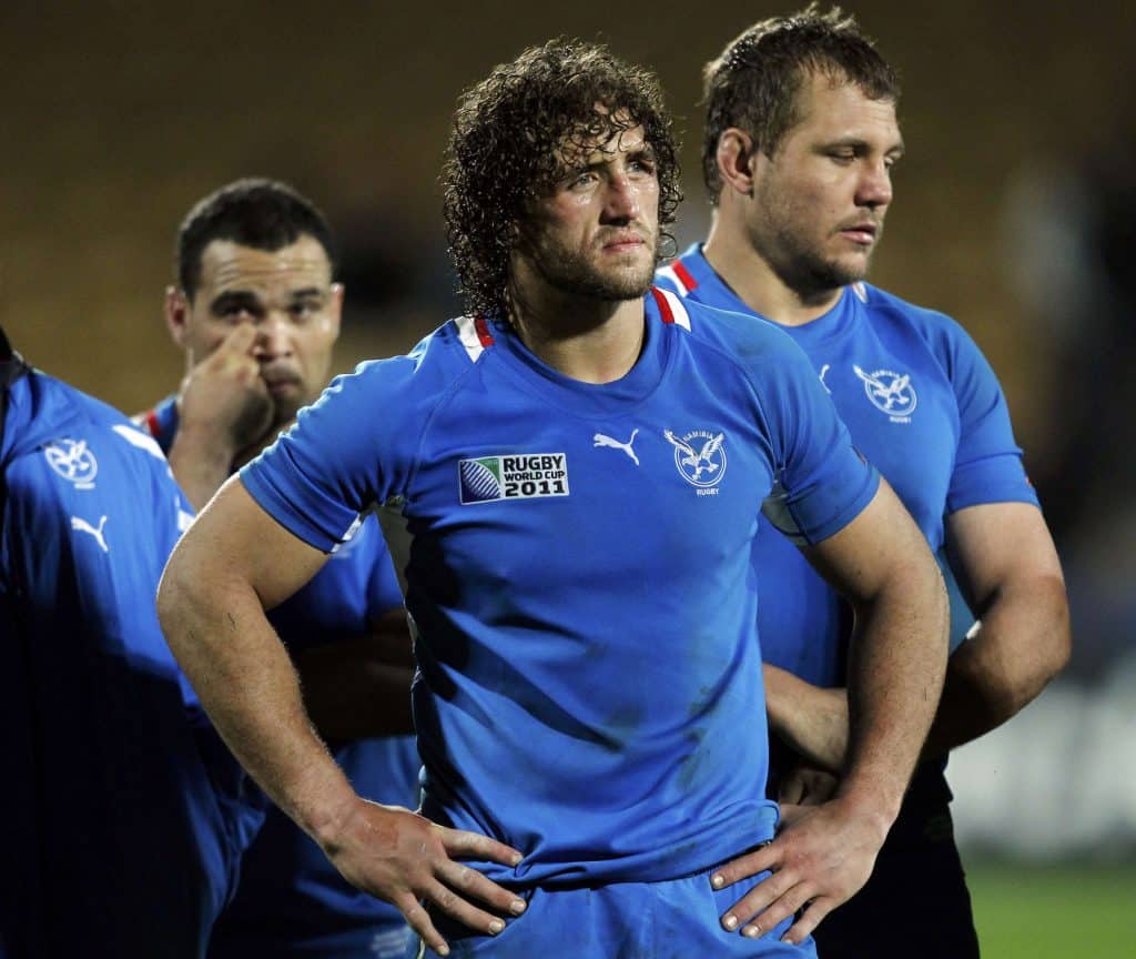 Namibia captain Jacques Burger and teammates react after losing their Rugby World Cup Pool D match against Wales at Stadium Taranaki in New Plymouth