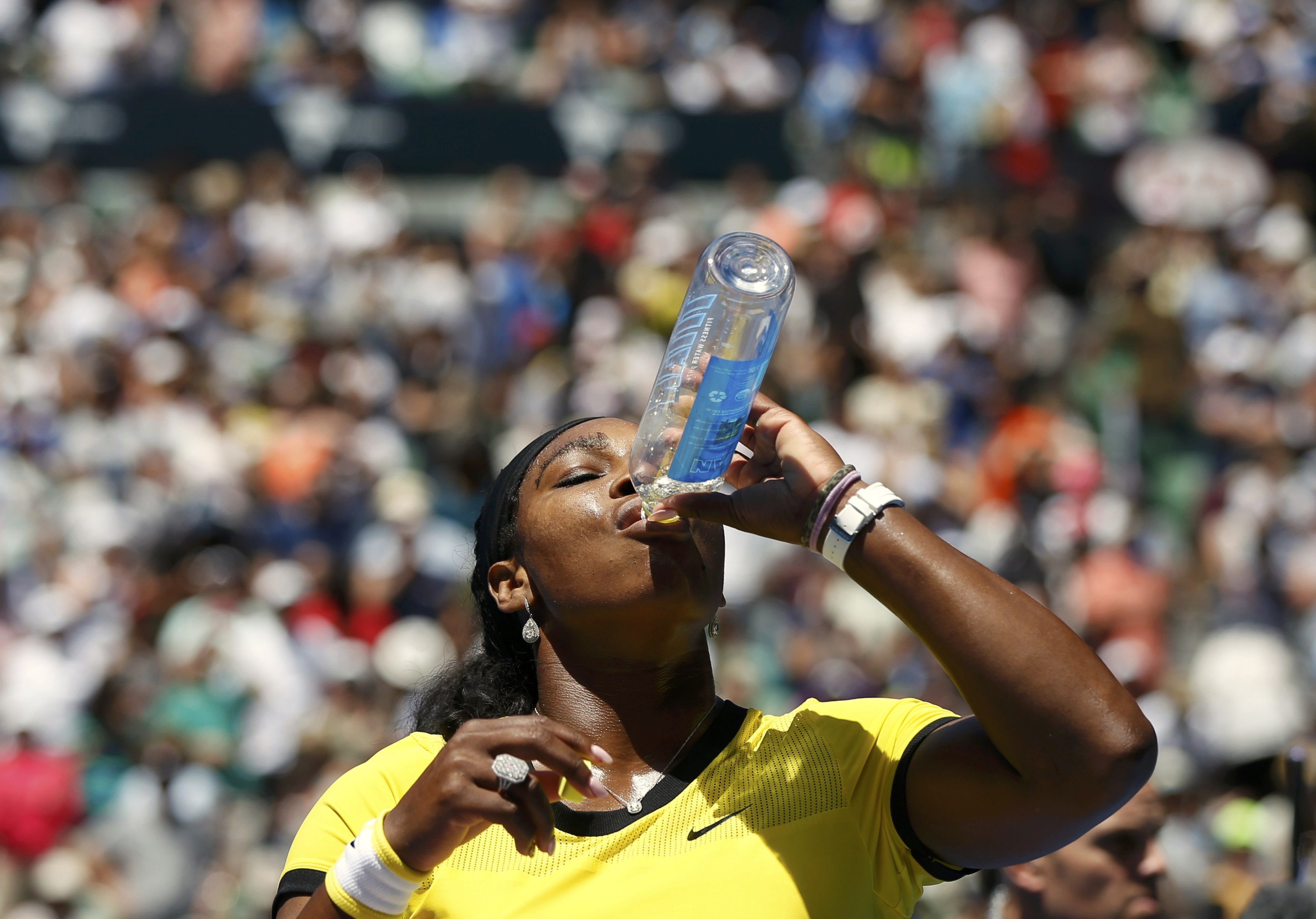 Williams of the U.S. takes a drink after winning her fourth round match against Russia's Gasparyan at the Australian Open tennis tournament at Melbourne Park